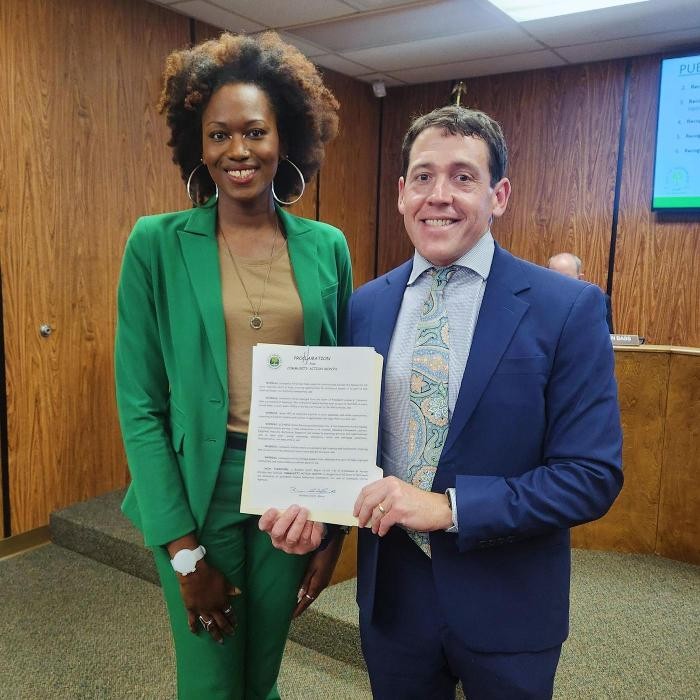 Greenwood Mayor Brandon Smith (right) is pictured with GLEAMNS Assistant Community Services Program Director (Zsaquez Flucker/left), who appeared before the council to request the Proclamation.